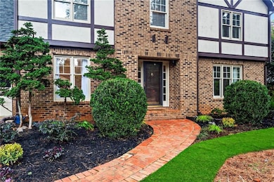 Entrance to property with brick siding