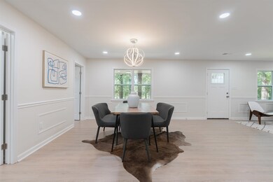 Dining area with an inviting chandelier and light 