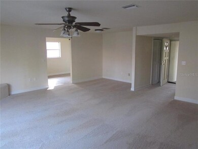LIVINGROOM LOOKING TOWARDS KITCHEN & FOYER