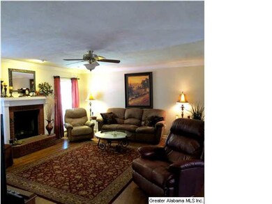 Large great room features hardwood flooring,  wood