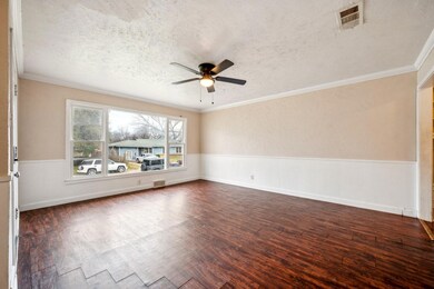 Unfurnished room featuring a textured ceiling, cei