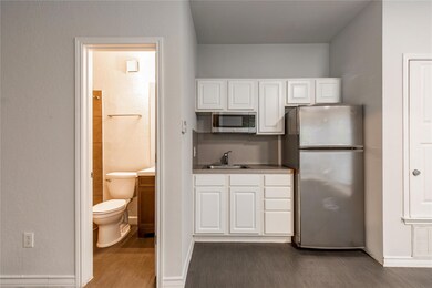 Kitchen featuring stainless steel appliances, dar