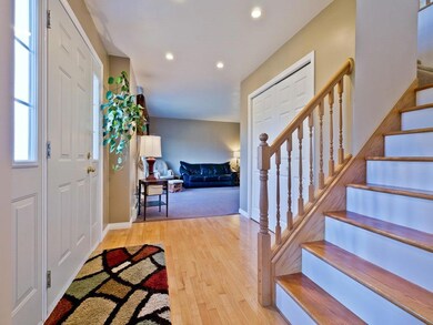 Wide, welcoming entryway with living...