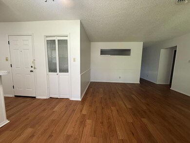 Unfurnished living room with wood finished floors