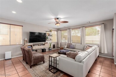 Living room with recessed lighting, stone tile flo