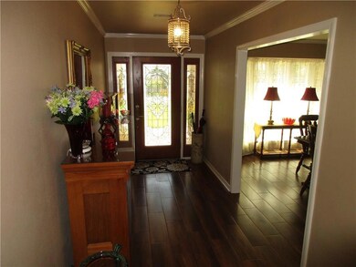 Foyer and dining room with ceramic tile floor