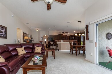 Living Room Looking to the Dining and a Kitchen