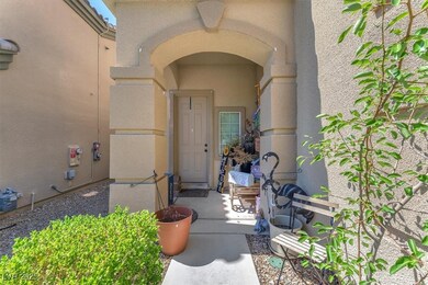 Entrance to property featuring stucco siding