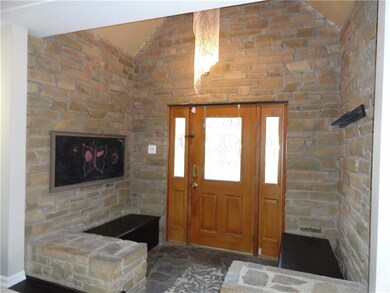 The foyer provides ample space for guests to accli