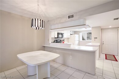Kitchen with white cabinetry, stainless steel rang