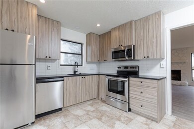Kitchen with new cabinetry and stainless-steel app