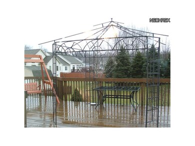 Very generously sized patio with wrought   iron Ga