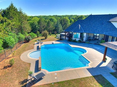 Pool with 2 waterfalls and diving board.