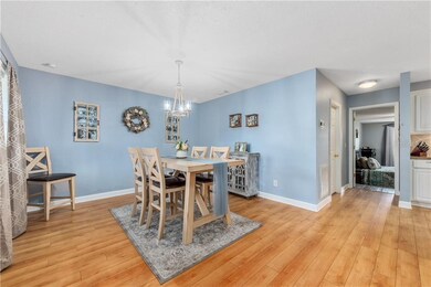 The spacious DINING ROOM greets you at the entrance and OPENS to the bright and airy KITCHEN.