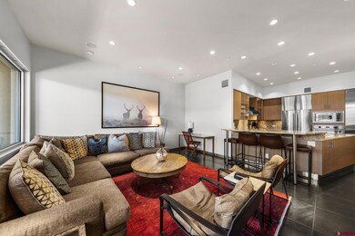 Living area with dark tile patterned flooring, rec