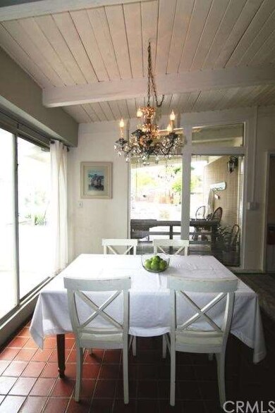 Sunny dining room with picture windows