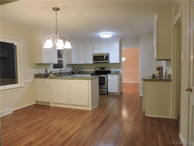 Eat-in kitchen with new wood floor.