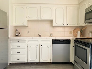 Repainted kitchen w/ new hardware