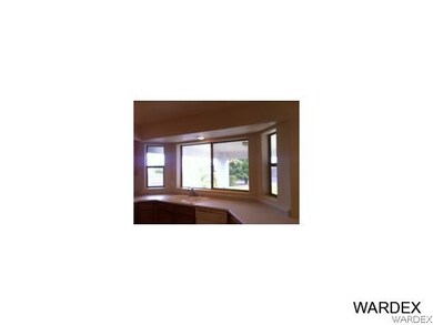 Bow window overlooks backyard