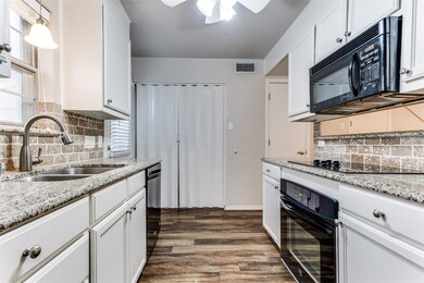 Kitchen featuring decorative light fixtures, white