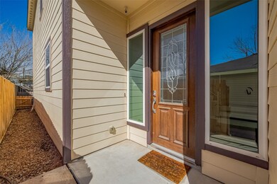 This home has a mahogany wood front door with deco