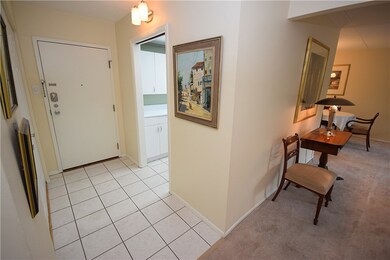 Tiled entry way with a large closet