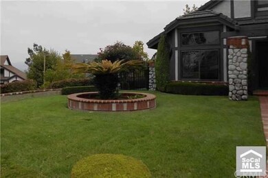 Professional landscaped yard with manicured box he