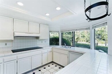 Pool views and natural light are enjoyed through t
