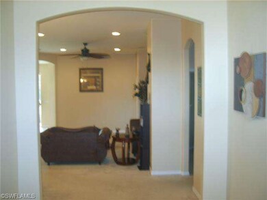 FOYER LOOKING INTO LIVING ROOM