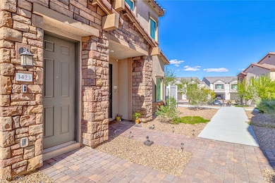 View of exterior entry with stone siding and a residential view