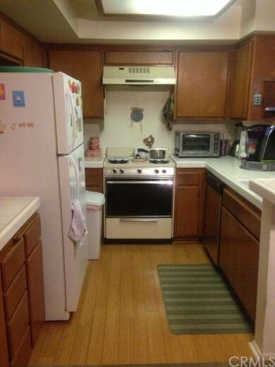 Bright open kitchen with bamboo flooring.
