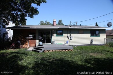 Fenced Backyard With Large BBQ Deck