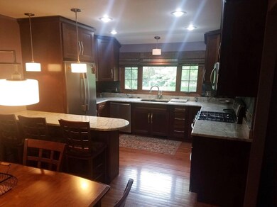 Kitchen overlooking pool in backyard.