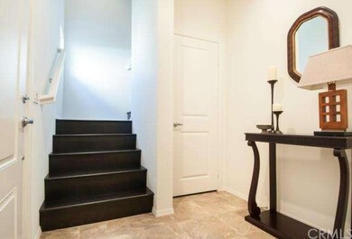 Main entrance and stairs to bedrooms.