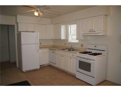 Kitchen. There are plenty of cabinets in this whit