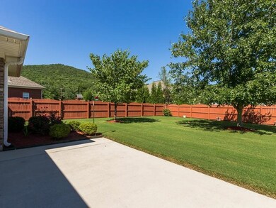 Spacious privacy fenced yard with mountain views all around.