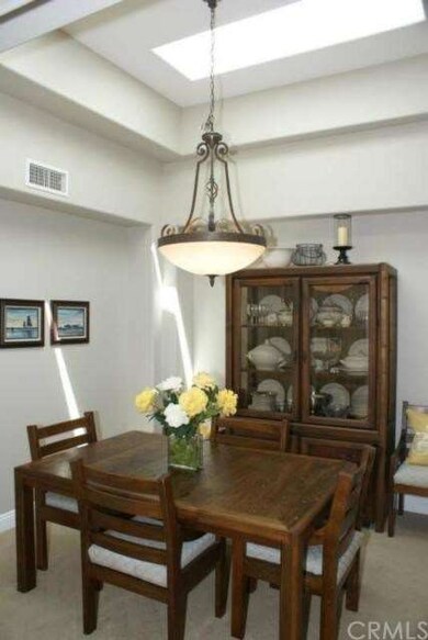 Formal Dining Room with tiered coffered ceiling an