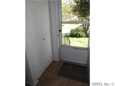 Foyer. New flooring and closet door.