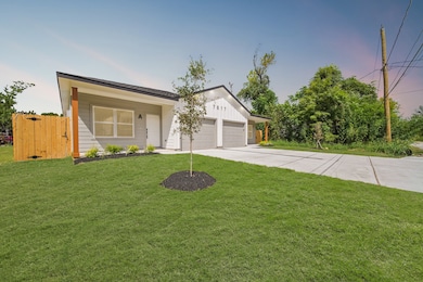 The front yard has manicured lawn.