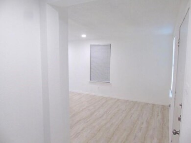 Spare room featuring baseboards, recessed lightin