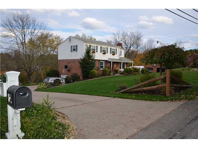 Exterior Front. Beautifully landscaped with a side
