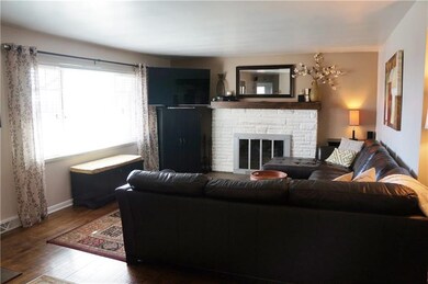 Wood burning fireplace and picture window in livin