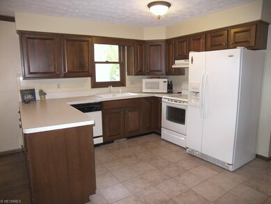Kitchen with tile flooring, appliances and great c