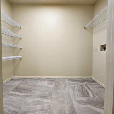 Pantry and utility featuring hookup for a washing 