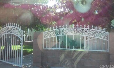 Block wall and wrought iron surrounds the front an