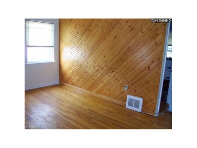 A Custom  design wall in the Living room. Hardwood