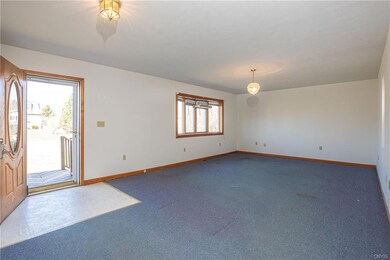 The front entryway with a large Living Room with a
