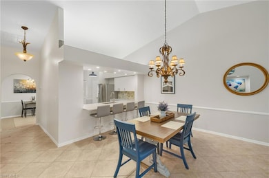 Dining room with baseboards, light tile patterned 