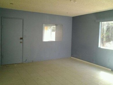 Spacious family room with tiled floors, side door 