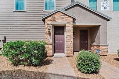 Property entrance featuring stone siding and stucc
